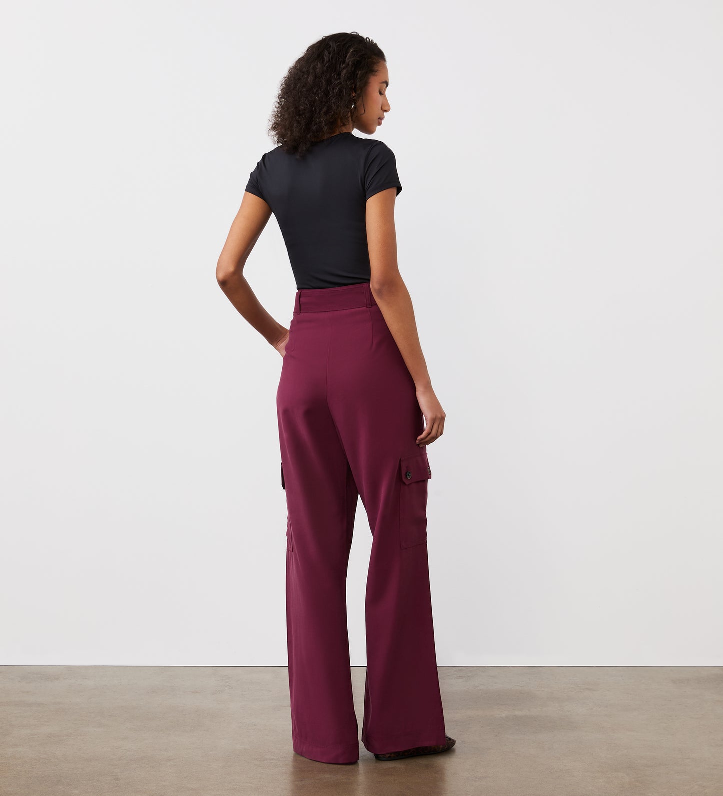 Full body back view of a model wearing the Maxine Merlot Wide Leg Trousers facing away from the camera.
