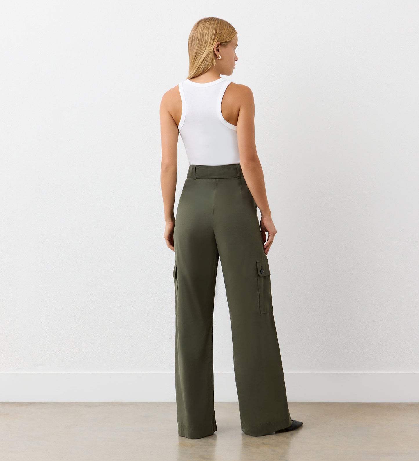 Full body back view of a model wearing the Maxine Khaki Wide Leg Trousers facing away from the camera.