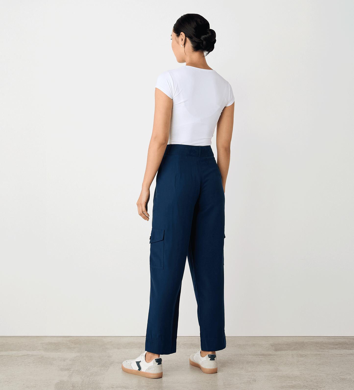 Full body back view of a model wearing the Sara Navy Cargo Trousers facing away from the camera.