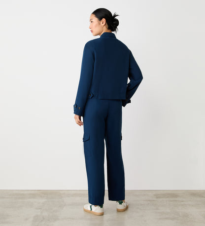 Full body back view of a model wearing the Alexa Navy Utility Jacket facing away from the camera.