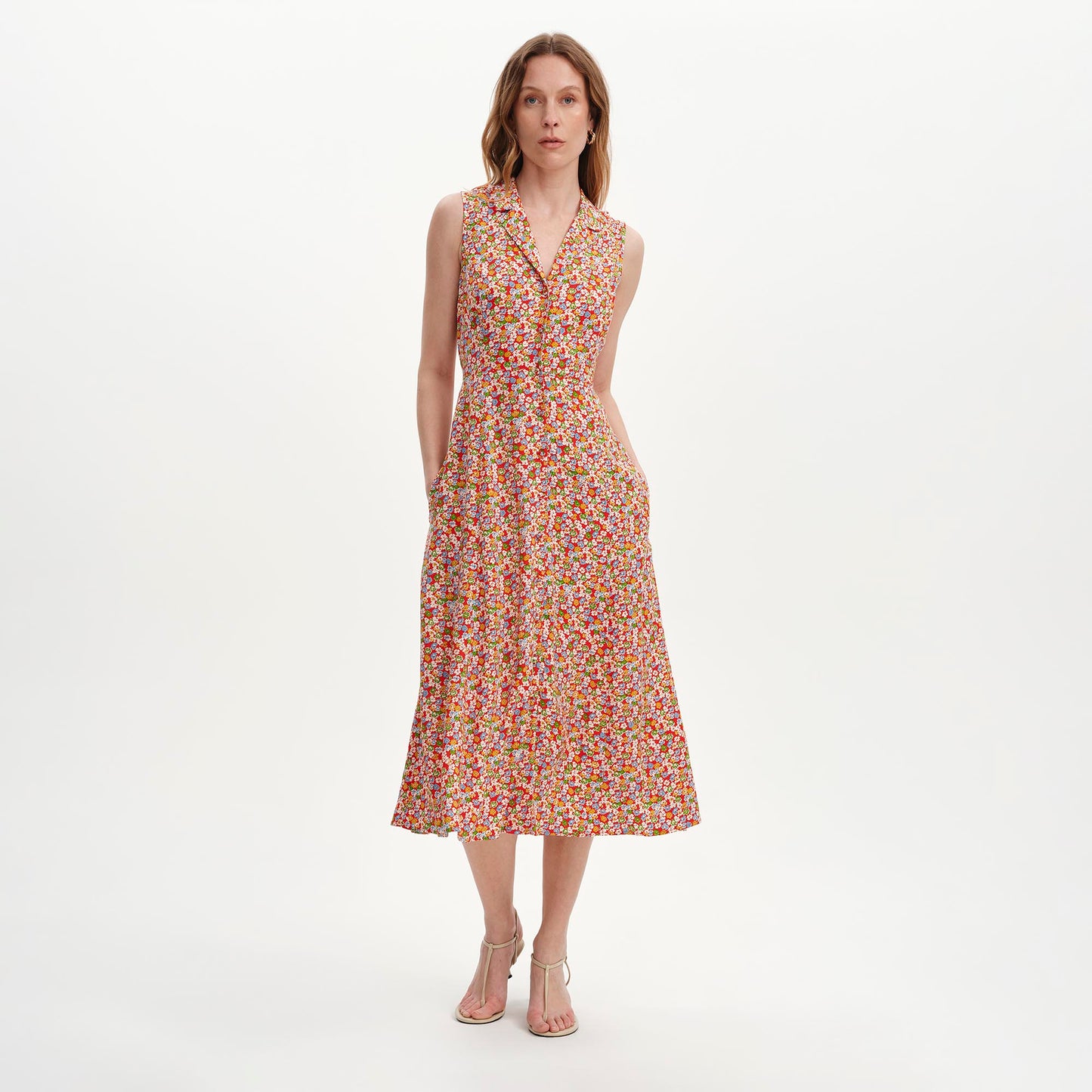 Woman wearing Beatrice Red Ditsy Sleeveless Midi Shirt Dress on a white background