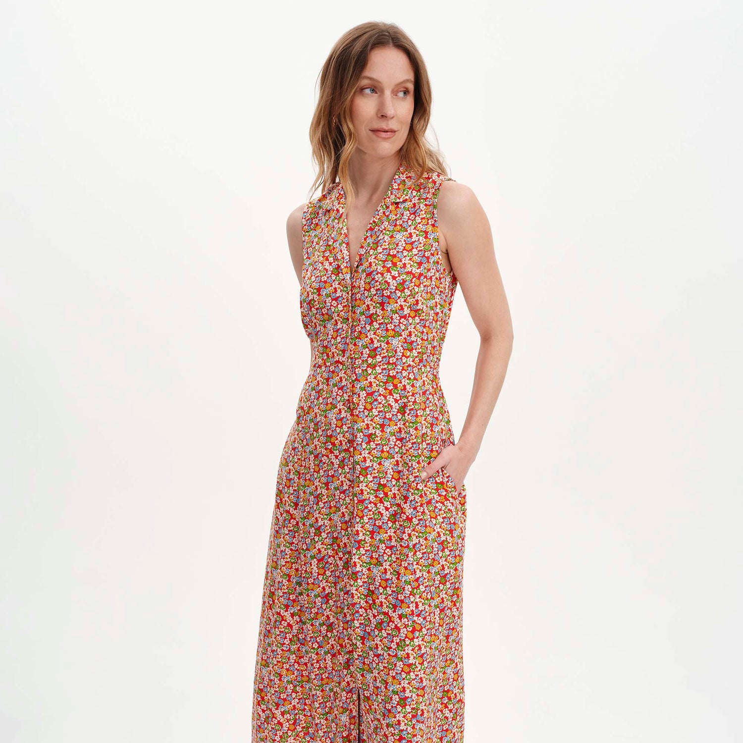 Woman wearing Beatrice Red Ditsy Sleeveless Midi Shirt Dress on a white background
