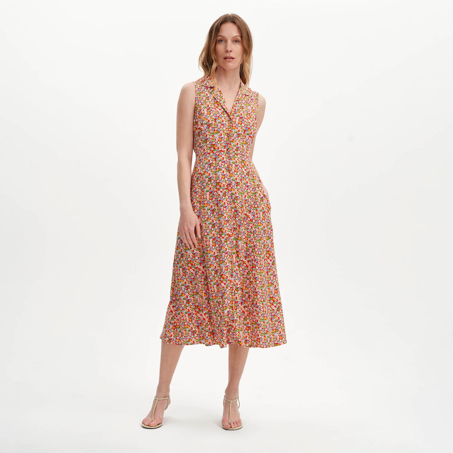 Woman wearing Beatrice Red Ditsy Sleeveless Midi Shirt Dress on a white background