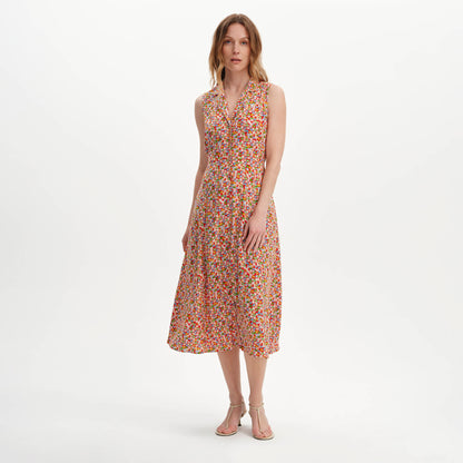 Woman wearing Beatrice Red Ditsy Sleeveless Midi Shirt Dress on a white background