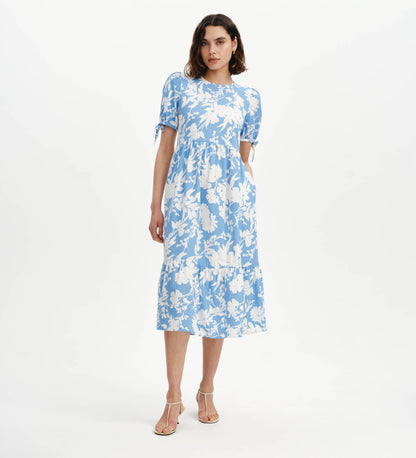 Woman wearing Jessa Blue Floral Puff Sleeve Midi Tiered Dress on a white background