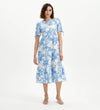 Woman wearing Jessa Blue Floral Puff Sleeve Midi Tiered Dress on a white background