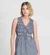 Woman wearing Hadlee Navy Cotton Gingham Shirred Bodice Sleeveless Midi Dress against a plain background
