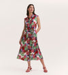 A woman in the Alida Red Floral Sleeveless Midi Dress stands against a plain light background, styled with red heeled sandals.