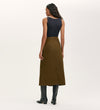 A woman in the Beth Khaki Canvas Midi Skirt with a high waistband.