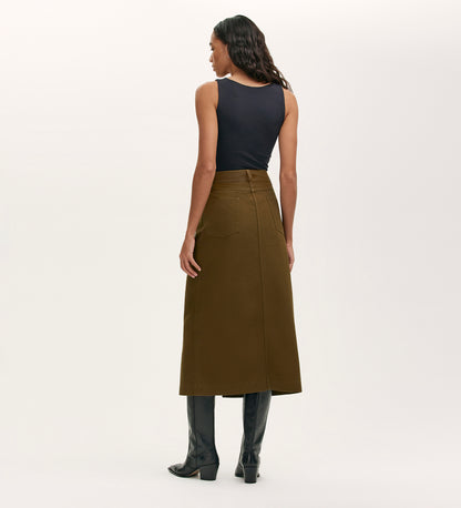 A woman in the Beth Khaki Canvas Midi Skirt with a high waistband.