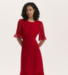 A woman with curly hair wears the Jennifer Red Chiffon Midi Dress, featuring sheer ruffled sleeves and a fitted waist. She stands against a plain light background, looking forward with a slight smile.