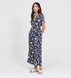 Woman wearing Uma Navy Floral Belted Wide Leg Jumpsuit on a white background
